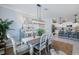 Sunlit dining room with stylish furnishings adjacent to the kitchen and with views to the living room at 43249 Treadway Dr, Punta Gorda, FL 33982