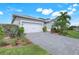 Beautiful single-Gathering home with a gray paved driveway at 43249 Treadway Dr, Punta Gorda, FL 33982
