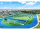 Beautiful community football field and track surrounded by greenery and views of the community beyond at 43249 Treadway Dr, Punta Gorda, FL 33982