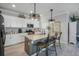Bright kitchen with a granite countertops, stainless steel appliances, and an island at 43249 Treadway Dr, Punta Gorda, FL 33982