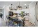 Bright kitchen featuring a granite island, stainless steel appliances and stylish pendant lighting at 43249 Treadway Dr, Punta Gorda, FL 33982