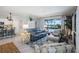 Cozy living room area with a sofa and view of the screened-in pool area at 43249 Treadway Dr, Punta Gorda, FL 33982