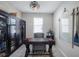 Home office with dark wood cabinets, a large desk, and nautical decor; perfect for a productive workspace at 43249 Treadway Dr, Punta Gorda, FL 33982