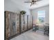 Home office with three rustic wooden cabinets against the wall, a desk, and a window with lots of sunlight at 43249 Treadway Dr, Punta Gorda, FL 33982