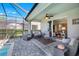 This screened patio is perfect for relaxing and entertaining with an outdoor lounge area at 43249 Treadway Dr, Punta Gorda, FL 33982