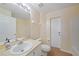 Bright bathroom featuring a single vanity, a toilet, and a bathtub with shower at 4413 S San Mateo Dr, North Port, FL 34288