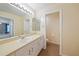 Bathroom featuring a single sink vanity, toilet, and tile flooring at 4413 S San Mateo Dr, North Port, FL 34288