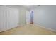 A bedroom featuring neutral paint, carpet, and a closet at 4413 S San Mateo Dr, North Port, FL 34288