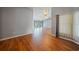 Light-filled living room with hardwood floors and large windows at 4413 S San Mateo Dr, North Port, FL 34288