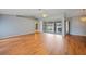 Spacious living room features wood floors and sliding glass doors to the lanai at 4413 S San Mateo Dr, North Port, FL 34288