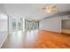 Open living area featuring beautiful hardwood floors, french doors, and ample natural light at 4413 S San Mateo Dr, North Port, FL 34288