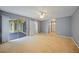 Spacious main bedroom with carpet flooring and access to outdoor patio at 4413 S San Mateo Dr, North Port, FL 34288