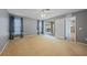 Spacious main bedroom with carpet flooring and access to an outdoor patio at 4413 S San Mateo Dr, North Port, FL 34288