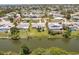 Aerial view of a tranquil residential neighborhood with waterfront access at 444 Edgewood Rd, Venice, FL 34293