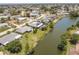 Scenic aerial view of a residential area with waterfront homes and lush landscaping at 444 Edgewood Rd, Venice, FL 34293