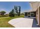 Enjoy the outdoors with views of a pond and trees from the concrete patio and screened in lanai at 444 Edgewood Rd, Venice, FL 34293