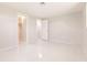 Light-filled bedroom with closet and doorway, showcasing a fresh, modern design at 444 Edgewood Rd, Venice, FL 34293