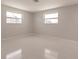 Sunlit bedroom with fresh paint and modern windows offering a clear view of the outdoors at 444 Edgewood Rd, Venice, FL 34293