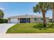 Well-maintained single-story home with a screened in porch and an extra-long concrete driveway at 444 Edgewood Rd, Venice, FL 34293