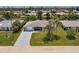 Charming home with a well-manicured lawn, stone accents, and a freshly paved driveway at 444 Edgewood Rd, Venice, FL 34293