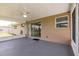 Relax in the screened lanai, seamless blend between indoor and outdoor living, leading to a concrete patio at 444 Edgewood Rd, Venice, FL 34293