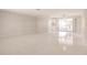 Bright living room with view of the backyard screened-in lanai at 444 Edgewood Rd, Venice, FL 34293