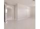 Bright, freshly painted living room with white walls and contrasting modern door hardware at 444 Edgewood Rd, Venice, FL 34293