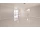 Open-concept living room with access to screened-in lanai at 444 Edgewood Rd, Venice, FL 34293
