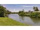 Scenic view of the waterway with lush vegetation surrounding the residential area at 444 Edgewood Rd, Venice, FL 34293