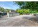 Large backyard featuring a barn-like building with trees offering cool shade at 4511 Wilkinson Rd, Sarasota, FL 34233