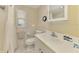 Clean bathroom featuring a shower, toilet, and a well-lit vanity area at 4511 Wilkinson Rd, Sarasota, FL 34233