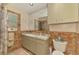 Bathroom features double sink vanity and a standard toilet at 4511 Wilkinson Rd, Sarasota, FL 34233