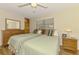 Comfortable bedroom with twin beds, dresser, ceiling fan, and ample natural light at 4511 Wilkinson Rd, Sarasota, FL 34233