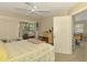 Inviting bedroom with natural light, ceiling fan, closet and access to the outdoor lanai at 4511 Wilkinson Rd, Sarasota, FL 34233