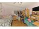 Bedroom includes furnishings, a ceiling fan, and carpeted floors at 4511 Wilkinson Rd, Sarasota, FL 34233