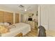 Cozy bedroom features a ceiling fan and closet space at 4511 Wilkinson Rd, Sarasota, FL 34233