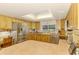 Spacious kitchen with wood cabinets, stainless steel appliances, and ample counter space at 4511 Wilkinson Rd, Sarasota, FL 34233