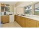 Functional kitchen with ample counter space and a bright window at 4511 Wilkinson Rd, Sarasota, FL 34233