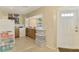 Cozy kitchen area with ample storage and adjacent entry door at 4511 Wilkinson Rd, Sarasota, FL 34233