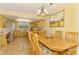 Bright kitchen featuring wood cabinets, stainless steel appliances, and adjacent dining area at 4511 Wilkinson Rd, Sarasota, FL 34233