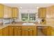Kitchen featuring wood cabinets, stainless steel appliances, and a view of the backyard at 4511 Wilkinson Rd, Sarasota, FL 34233