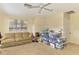 Comfortable living room with neutral carpet and ample storage space at 4511 Wilkinson Rd, Sarasota, FL 34233
