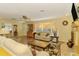 Cozy living room featuring tile floors, a fireplace, and a bright bay window at 4511 Wilkinson Rd, Sarasota, FL 34233