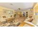 Bright and open living room with tile flooring and comfortable seating arrangements at 4511 Wilkinson Rd, Sarasota, FL 34233