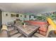 Outdoor patio features a grill, patio table, and covered hot tub at 4511 Wilkinson Rd, Sarasota, FL 34233