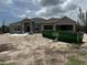 Single story home with a modern design, visible garage and unfinished yard at 9461 Migue Cir, Port Charlotte, FL 33981