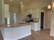 Modern kitchen with granite countertops, white cabinets, stainless steel appliances at 10023 Greetings St, Port Charlotte, FL 33981
