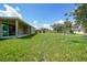 Spacious backyard with healthy green grass at 1057 Presque Isle Dr, Port Charlotte, FL 33952