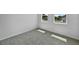 Bedroom with two windows and neutral carpet at 1057 Presque Isle Dr, Port Charlotte, FL 33952