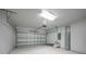 Attached garage with white walls and sealed concrete floor at 1057 Presque Isle Dr, Port Charlotte, FL 33952